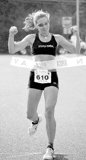 JEFF HUNTLEY Barbara Moldoch of Point Pleasant crosses the finish line first in Sunday&rsquo;s Freehold Area Running Club 5K Race for Women in Marlboro. 