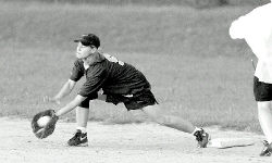 JERRY WOLKOWITZ Higgins KAOS first baseman Donna Smith stretches for a throw during a game against Freeman Funeral Home/Matty&rsquo;s Auto Body Gravediggers last Wednesday. 