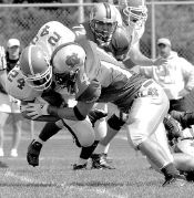 JERRY WOLKOWITZ Colts Neck linebacker Mark Sevard knocks Shore Regional running back Dan Carhart off his feet during the teams&rsquo; match-up on Saturday. The Cougars fell short in the game, 14-13. 