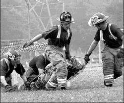 SARAH McCOLGAN  Members of the three-time defending champion team, Manalapan station 26-2, try for their fourth title in the Fireman of the Woods Competition at Veterans Park, North Brunswick.