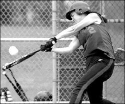 JERRY WOLKOWITZ Manalapan&rsquo;s Kristy Kwiatkowski shows off the swing that made her one of the most feared hitters in the Shore Conference over the last three years. She also was one of the state&rsquo;s best catchers (below).