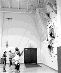 JERRY WOLKOWITZ  Youngsters participating in Marlboro&rsquo;s summer recreation program make their way up the new climbing wall inside the Marlboro Recreation Community Center.