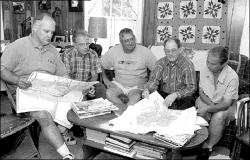 JERRY WOLKOWITZ  Members of the grassroots group Farmers Against Rezoning in Manalapan meet to discuss a rezoning proposal supported by some members of the Township Committee that would create 6- and 10-acre residential lots and, say the farmers, destroy the equity they have in their land.