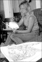 JERRY WOLKOWITZ  Coral Silsbe of Highbridge Horse Farm, Manalapan, looks over her notes before a meeting with fellow farmers to discuss zoning issues in the township.