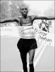 SARAH McCOLGAN  Kenya&rsquo;s Gabriel Muchiri crosses the finish line first in Saturday&rsquo;s George Sheehan Classic in Red Bank. Muchiri, now a resident of Westchester, Pa., finished the five-mile race in 23:30.