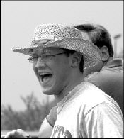 Larry Hlavenka of Manalapan shouts encouragement to his horse during Freehold Raceway&rsquo;s opening day Friday.