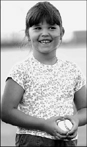 FARRAH MAFFAI Maribeth Guarino, 6, of Freehold Township, gets set to throw out the ceremonial first pitch at the Aug. 15 Lakewood BlueClaws game. Maribeth was a winner in a Greater Media Newspapers contest.