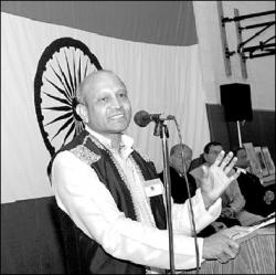 FARRAH MAFFAI  With the flag of India as a backdrop, Vivek Sinha addresses guests at India Independence Day ceremonies held at the Marlboro Recreation Community Center on Saturday. The event was sponsored by the new Indian American Association of Marlboro.