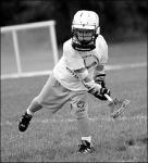 SARAH McCOLGAN  Scott Buchanan, 8, of Freehold, passes the ball at the Freehold Recreation Lacrosse league&rsquo;s final meeting of the summer on Sunday at Liberty Oak Park.