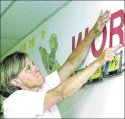 JERRY WOLKOWITZ C. Richard Applegate School second-grade teacher Dee Andrejewski makes final preparations in her Freehold Township classroom as schools prepare to welcome students on Sept. 6.