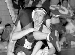 JERRY WOLKOWITZ  Marlboro&rsquo;s Randy Frankel holds off Jackson&rsquo;s Adam Berking en route to a District 21 championship at 135 pounds at Manalapan High School on Saturday.