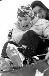 FARRAH MAFFAI  Jessica Chaddon and Nicole Oliverio of Freehold aren&rsquo;t playing hooky &mdash; they&rsquo;re just enjoying a day off from school on Tuesday by doing some sledding at Holmdel Park, Holmdel. Meanwhile, adults had the tough task of digging out from under a storm that dropped about 24 inches of snow on western Monmouth County between Sunday afternoon and Monday evening.
