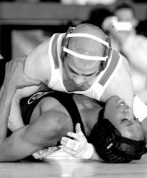 CHRIS KELLY staff Manalapan&rsquo;s Nick Manochio works Toms River South&rsquo;s Mario Lynn for back points en route to a 23-8 win during a 112-pound quarterfinal match in Toms River on Friday.