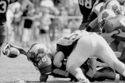 PHOTOS BY ERIC SUCAR staff Colts Neck running back Ashton Jackson dives into the endzone for a touchdown during the first quarter of their game against Howell in Colts Neck on Saturday. 