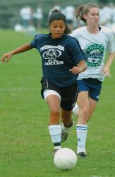 CHRIS KELLY staff A member of the Freehold Boro soccer team tries to advance the ball against Colts Neck during a recent home scrimmage. 