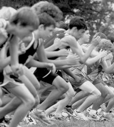 PHOTOS BY ERIC SUCAR AND JEFF GRANIT staff At left, a line of boys jump off to the lead at the start of the Sophomore Boys 5K race at the Battle of Monmouth Class Meet at Battleground State Park in Manalapan on Saturday. At right, Colts Neck running back Ashton Jackson tries to elude Toms River South's Ray Camaraza during Thursday's game in Colts Neck. 