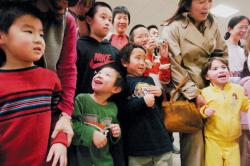 ERIC SUCAR staff Children of all ages watch a performance by the New York Hung Sing Kwoon Lion Dance Team during the 2008 Marlboro Chinese New Year celebration held at Marlboro High School on March 8. The popular community event included cultural exhibits, vendors and performances of music and dance. For another photograph, see page 50. 