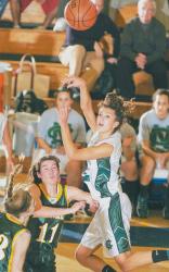 ERIC SUCAR staff Colts Neck High School's Brooke Hampton tosses up a shot during the second half of the Cougars' 49-28 victory over Montgomery in the Central Jersey Group IV state sectional title game on March 10. For more on Colts Neck's state tournament run, see Sports. 