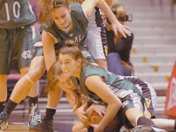 JEFF GRANIT staff Colts Neck High School's Tiffany DeTulio (r) battles St. John Vianney High School's Missy Repoli for a loose ball with help from teammate Emily Laurence in the championship game of the NJSIAA Tournament of Champions on March 23 at the Izod Center, East Rutherford. The Cougars lost 56-44. 