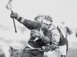 JEFF GRANIT staff Freehold Township High School's Bryce Carroll (front) is pressured by Howell's Rob Hart during a lacrosse match between the Patriots and Rebels on April 23 in Howell. Freehold Township got goals from seven players and defeated Howell, 14-2. 